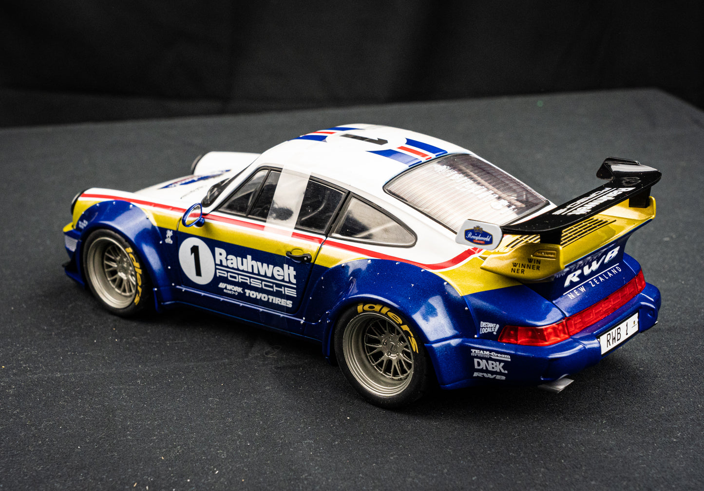 Porsche 911 (964) RWB Rauh - Welt 2022 blue / white / red / gold - Solido 1:18